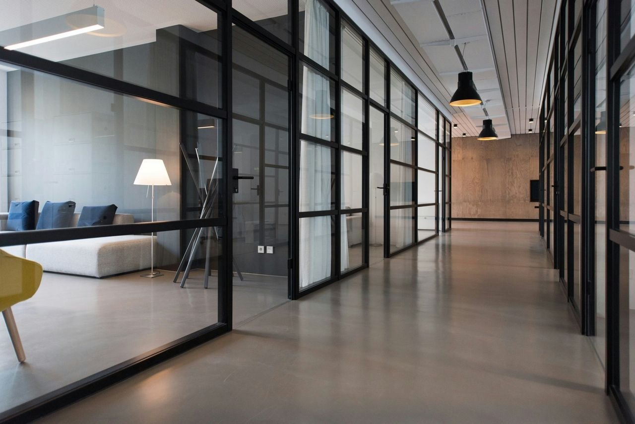 Office tenant improvement with glass-walled rooms