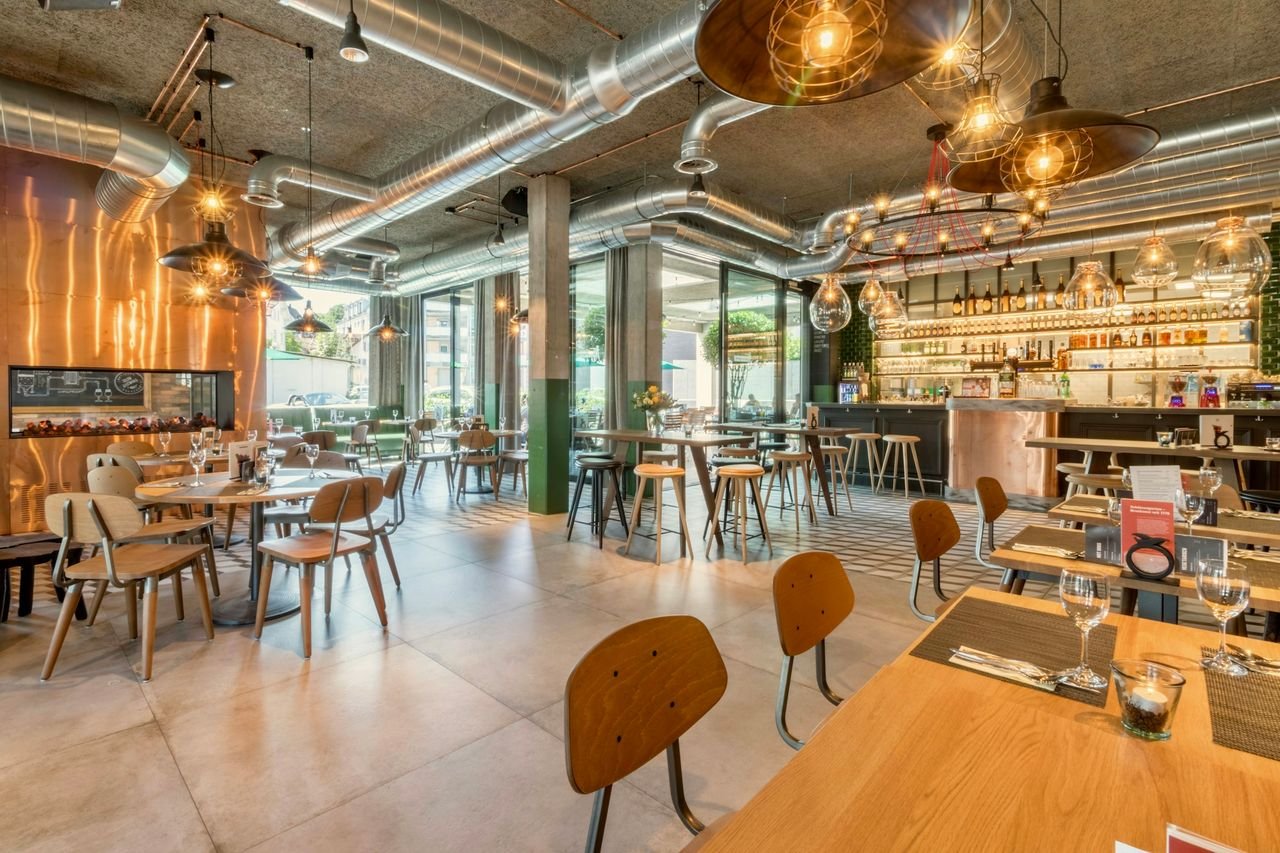 Restaurant build-out with wood tables and warm lighting