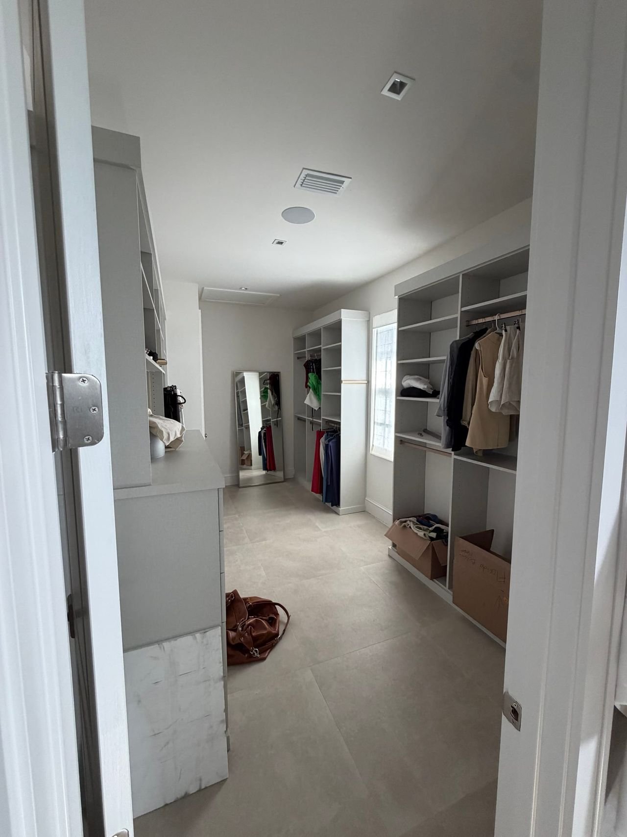 Dressing room and walk-in closet off the primary suite