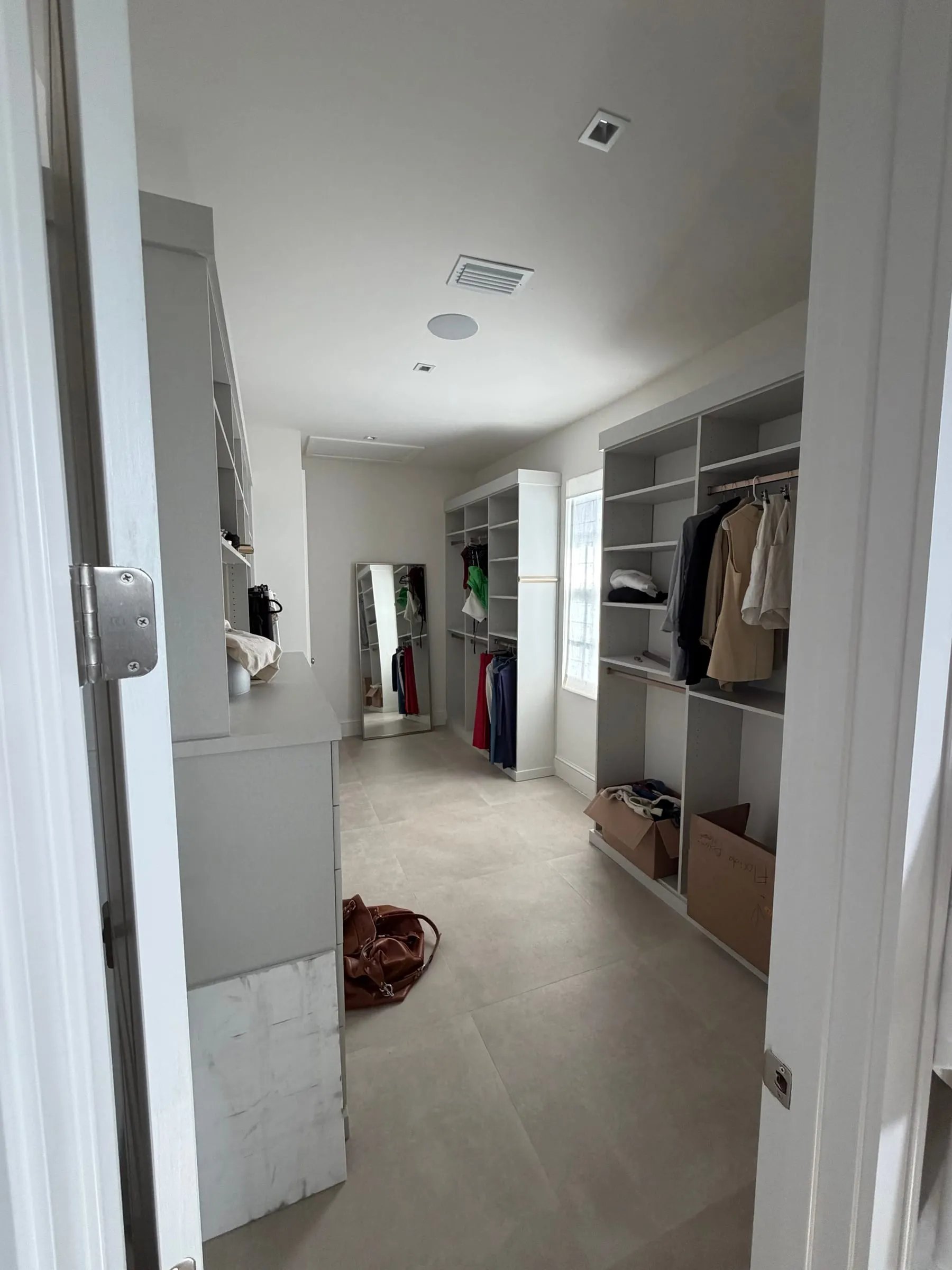 Dressing room and walk-in closet off the primary suite