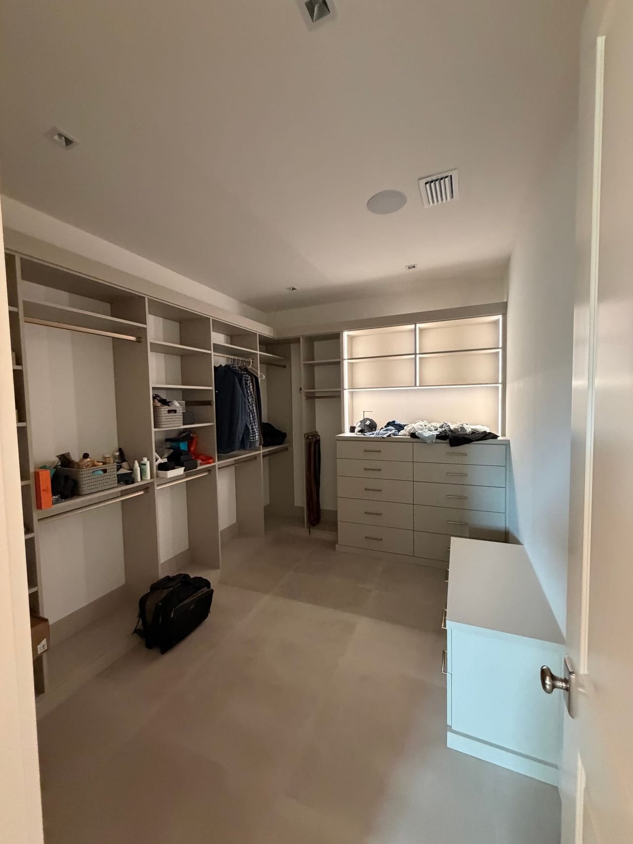 Walk-in closet with custom shelving and island