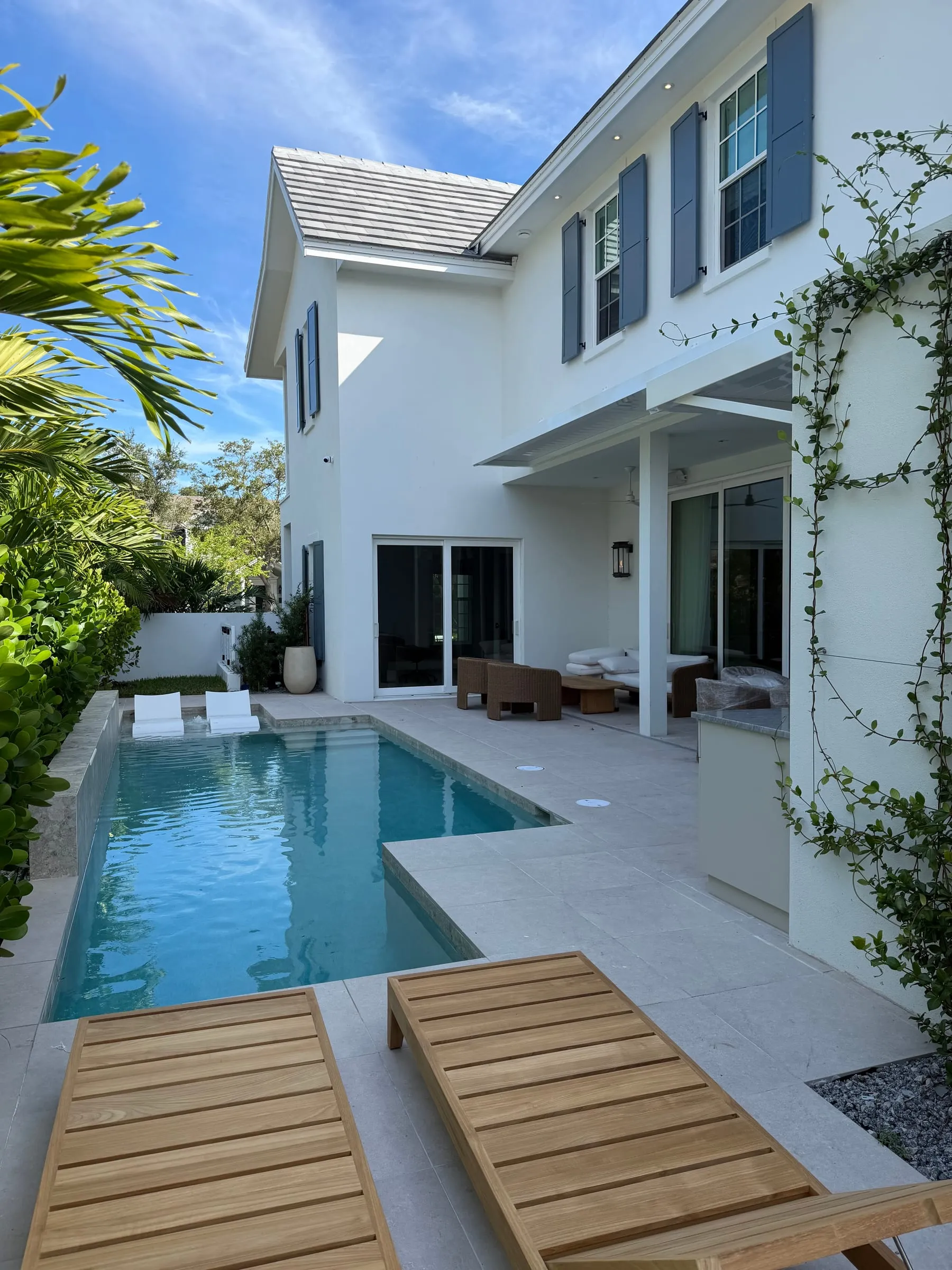 Backyard pool courtyard and covered lanai of a custom home
