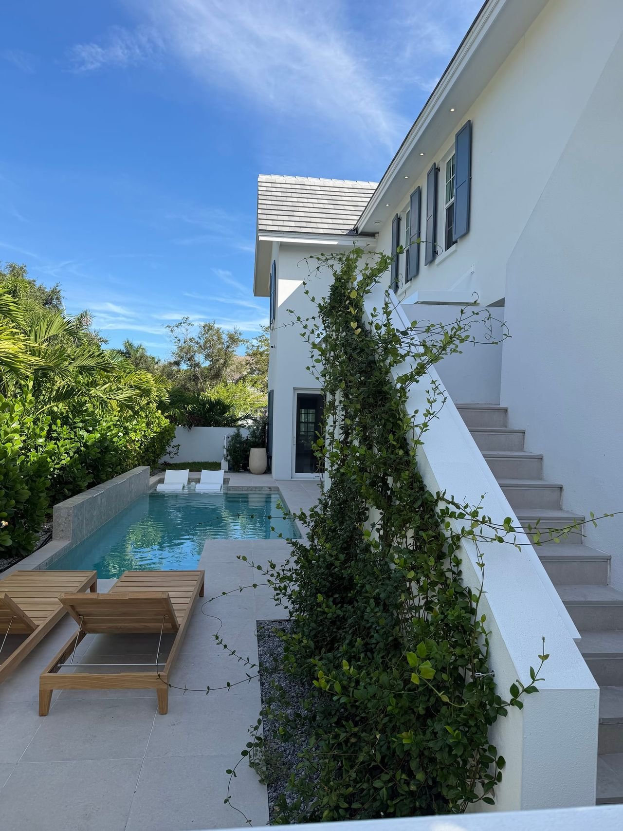 Lap pool, sun deck and exterior stair at a new custom home
