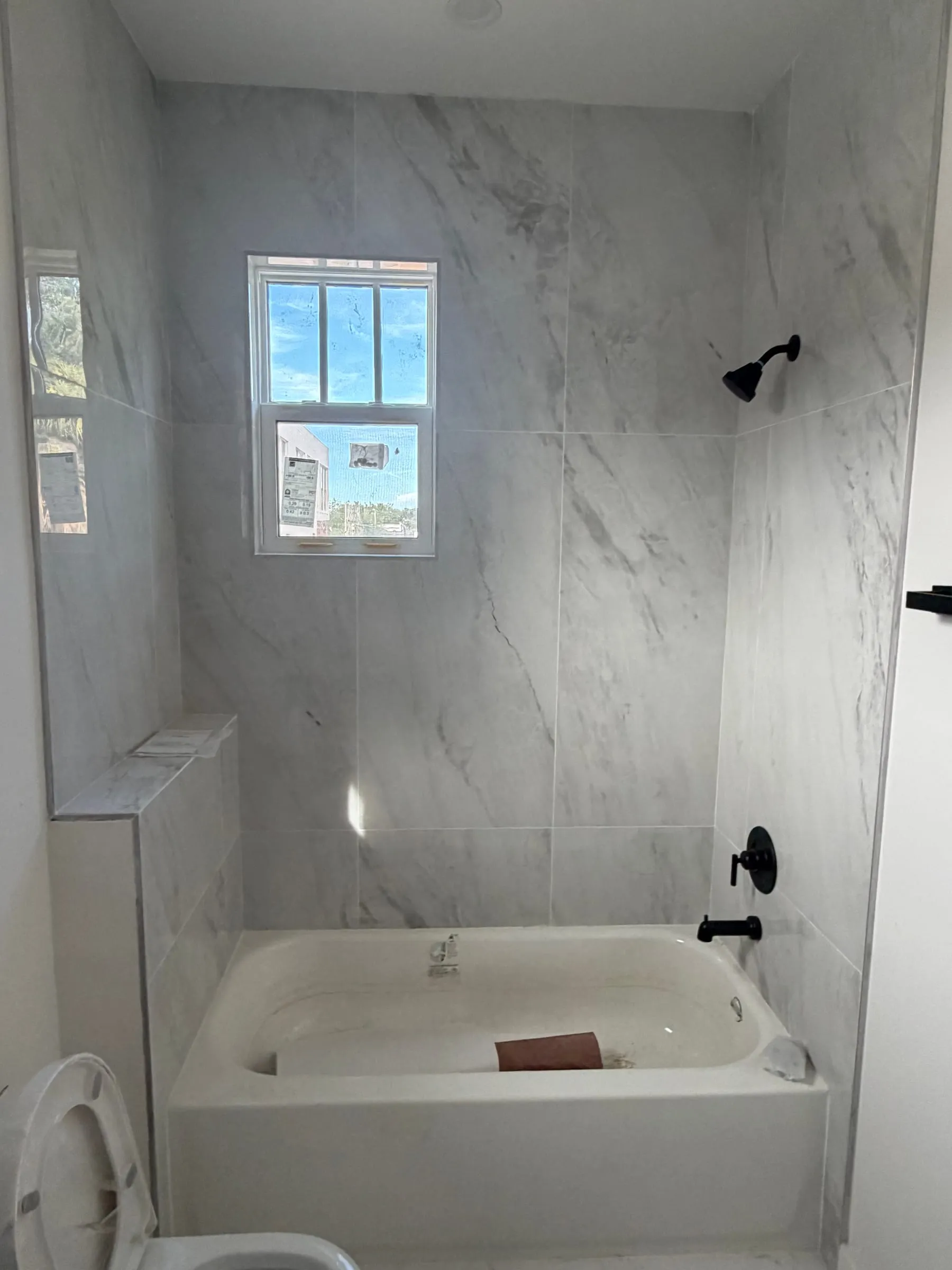 Tub and shower combination with tile surround